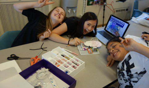 Student pose for picture while working together on littleBits.