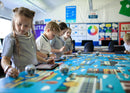 Students learning STEM while working with Sphero BOLT on the Sphero Code Mat.