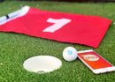 Sphero mini golf with phone and golf flag next to a golf hole.