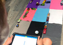 Mini golf course made out of felt and Hot Wheels car and kid programming using draw canvas.