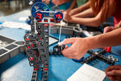 Students build simple machines with Sphero Blueprint Build kits.