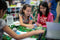 Two girls sit at a table working on a classroom icebreaker as part of their back to school activities.
