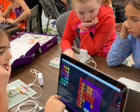 Group of students working together on littleBits products.