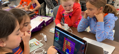 Group of students working together on littleBits products.