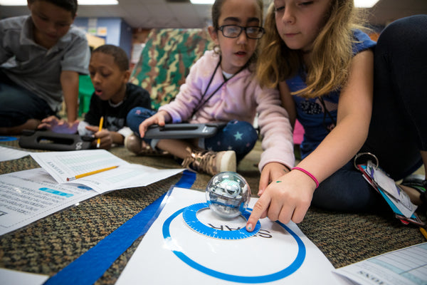Group of students working together on Sphero BOLT Layers of the Earth STEM activity.