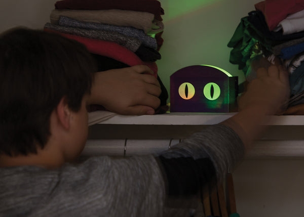 Boy playing with light up eyes invention.