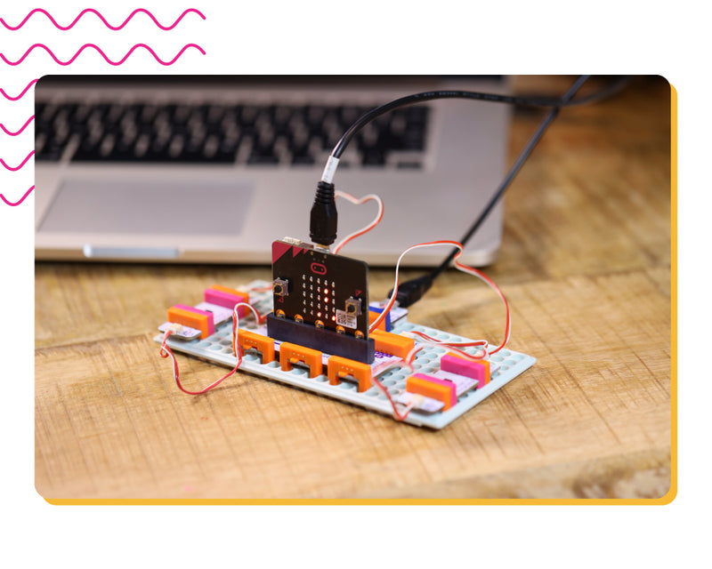 micro:bit invention with laptop in the background.