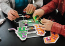 Kids snapping littleBits together to make an arcade game.