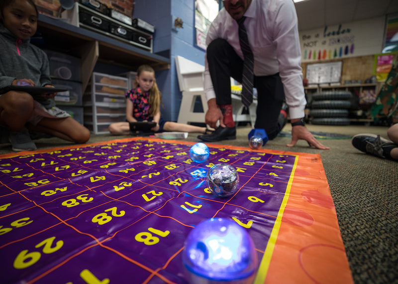 Teacher and students learning STEM while playing with Sphero BOLT.