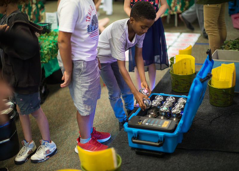 Students grabbing Sphero BOLT from Sphero BOLT Power Pack.