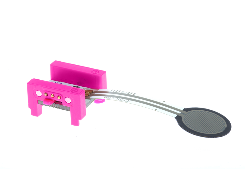 Pink littleBits i11 pressure sensor bit side view.