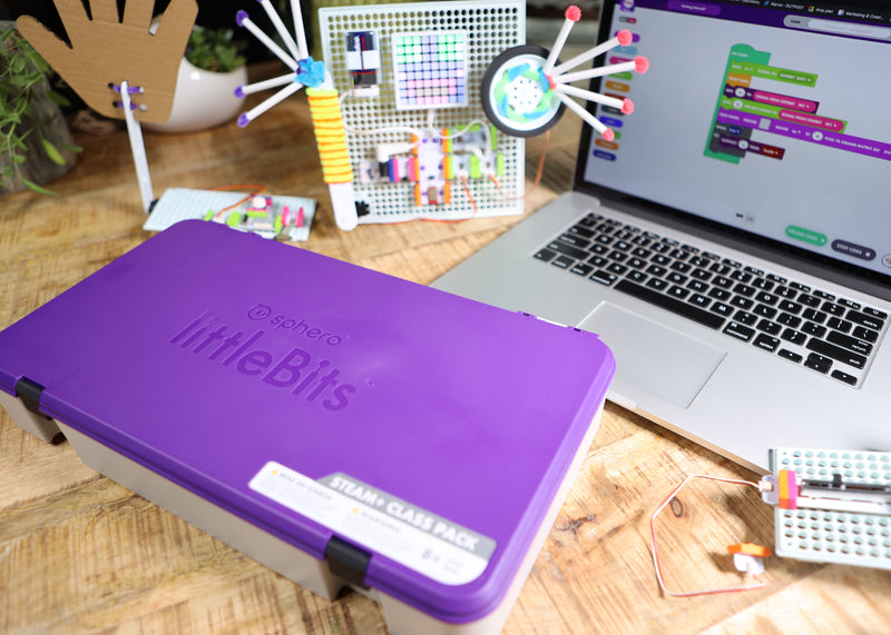 Two littleBits inventions next to laptop with code blocks and tackle box.