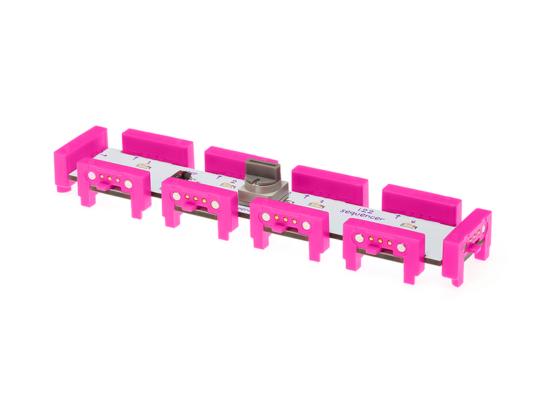 Pink littleBits i22 sequencer bit side view.