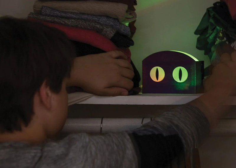 Boy playing with night light invention.